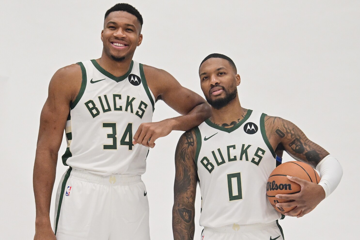 Oct 2, 2023; Milwaukee, WI, USA; Milwaukee Bucks forward Giannis Antetokounmpo (34) and guard Damian Lillard (0) pose for a picture during media day in Milwaukee.  Mandatory Credit: Benny Sieu-USA TODAY Sports 